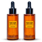Two bottles of 'The Hair Generation' hair product on a white background