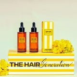 Two bottles and a box of 'The Hair Generation' product on a striped stand with yellow flowers.