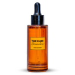 Amber glass bottle with black cap on a white background, featuring 'The Hair Generation' label.