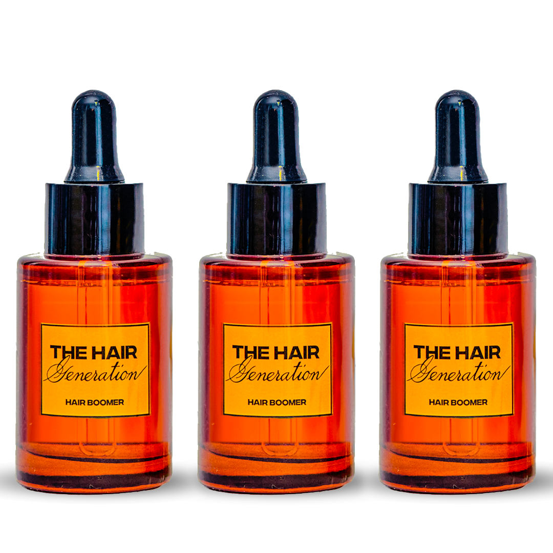 Three bottles of 'The Hair Generation' Hair Boomer product on a white background