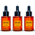 Three bottles of 'The Hair Generation' Hair Boomer product on a white background